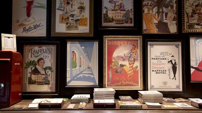 Framed posters are displayed in the Raffles Boutique at the Raffles Hotel. Bloomberg
