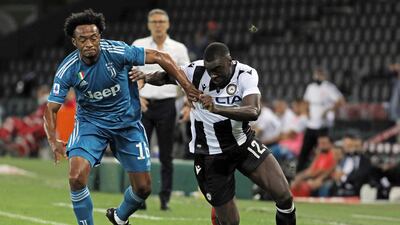 Juventus' Juan Cuadrado, left, and Udinense's Ken Sema in action during the Serie A Soccer match on Thursday. AP