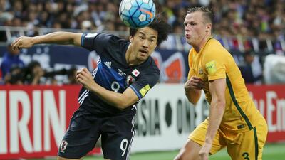 Shinji Okazaki, left, helped Japan beat Australia 2-0 on Thursday to ensure their place at the 2018 World Cup. Koji Sasahara / AP Photo