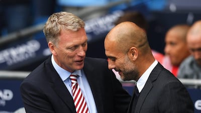 David Moyes, manager of Sunderland and Pep Guardiola, manager of Manchester City shake hands prior to kick off during the Premier League match between Manchester City and Sunderland at Etihad Stadium on August 13, 2016 in Manchester, England. Stu Forster / Getty Images