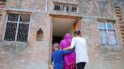 The family of Markandey Chauhan, who was killed in the Emirates Road crash, enter the home he was building for them in Uttar Pradesh, northern India. Photo: Burjeel Holdings