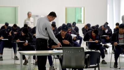 Saudi students taking their final exams at a workshop in the Higher Institute for Plastics Fabrication on June 13, 2016 in Riyadh. The institute is hoping to reduce the kingdom's high unemployment rate. Fayez Nureldine/AFP
