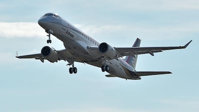 Japan's first domestically produced passenger jet, the Mitsubishi Regional Jet (MRJ), takes off at Nagoya airport. Mitsubishi aims to show the plane at the Paris air show. Kazuhiro Nogi / AFP