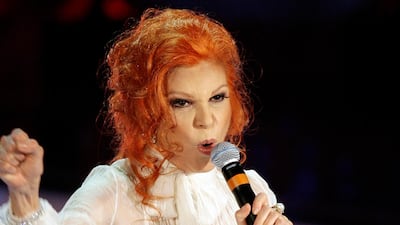 Italian singer Maria Ilva Biolcati, knowns as Milva, performs "The show must go on" during the Sanremo Italian song contest, in San Remo, Italy. Milva has died at her home in Milan at the age of 81, Italy's culture minister announced on Saturday. AP Photo