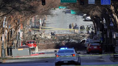 Investigators work near the site of an explosion on 2nd Avenue that occurred the day before in Nashville, Tennessee, U.S. REUTERS