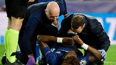 CHelsea medical staff check on Tammy Abraham. AFP