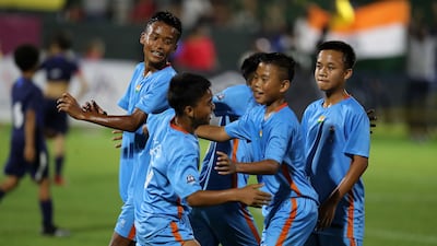 Players of India's Minerva Academy celebrating after winning the U12 Mina Cup final against La Liga HPC Academy on Monday, April 11, 2022 at Jebel Ali Centre of Excellence in Dubai. All photos Pawan Singh / The National