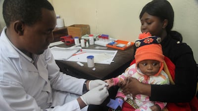 A doctor tests a child for malaria at the Ithani-Asheri Hospital in Arusha, Tanzania. Reuters