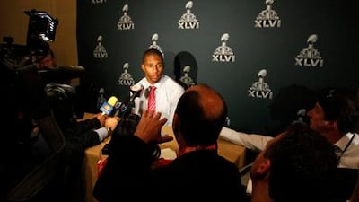 Victor Cruz, the New York Giants wide receiver, faces the media after the team arrived in Indianapolis ahead of Sunday's Super Bowl.