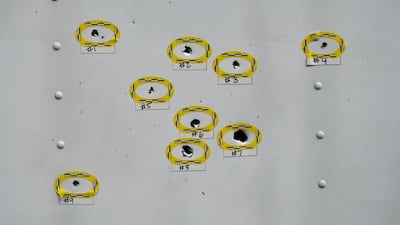 Bullet holes on the side of a lorry are marked by police a day after a mass shooting in Philadelphia. Reuters