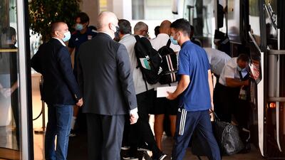 Lyon's French defender Leo Dubois, centre, arrives at the team hotel in Cascais ahead of the Champions League quarter-final against Manchester City. AFP