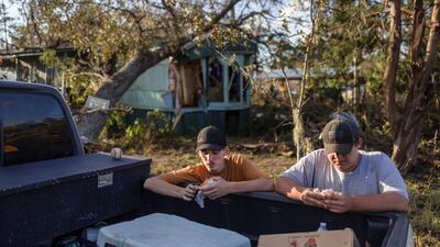 Waylon and Nash Harris at their home in Steinhatchee, Florida, in Helen's wake on September 27. Reuters