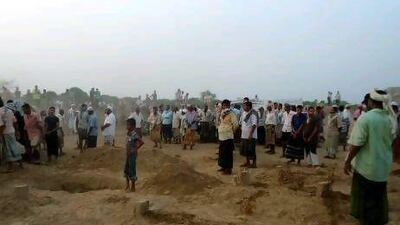 Onlookers gather at the scene of a suicide bombing in the southern Yemen province of Abyan. At least 45 people died in the attack, which is being blamed on Al Qaeda.