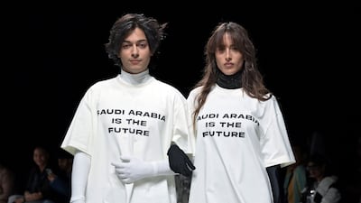 The 'Saudi Arabia is the future T-shirt' worn by Mishaal Tamer and Taleedah Tamer on the runway. Photo: Riyadh Fashion Week