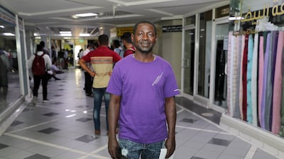 Kwaku Danso, from Ghana, queues to apply to become an RTA taxi driver.