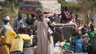 Refugees fleeing violence in South Sudan cross the border into Uganda on Janaury 6, 2014. As of September 2016, more than one million refugees have fled the civil war in South Sudan. Rebecca Vassie / AP