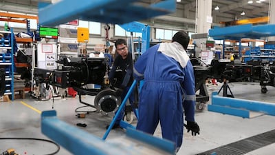 Workers at the NIMR military vehicle production facility in the Tawazun Industrial Park in the Al Ajban area north of Abu Dhabi. Christopher Pike / The National