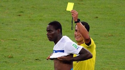Mario Balotelli was shown yellow for taking his shirt off after scoring Italy's winner. Laurence Griffiths / Getty Images