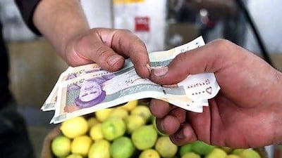 The psychological impact of the Iranian rial's plunge against the US dollar is perhaps more important than its economic effect. Abedin Taherkenareh / EPA
