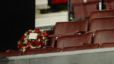 A wreath is laid on Sir Bobby Charlton's old seat in the director's box at Old Trafford. AP
