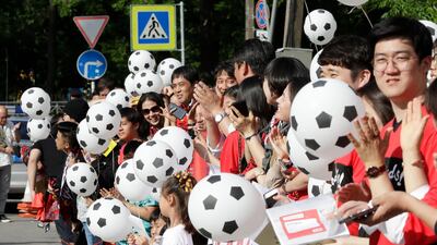 South Korea's supporters hold football-shaped balloons on their side's arrival at the team hotel in Saint Petersburg. AP