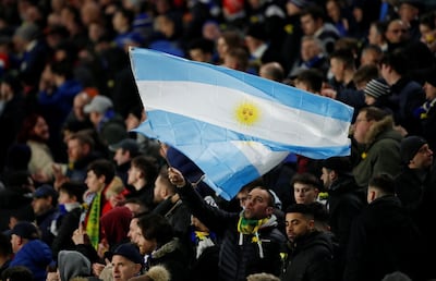 Cardiff City fans wave an Argentina flag to pay tribute to Emiliano Sala before a game. Andrew Boyers / Reuters