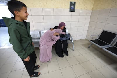 Relatives mourn the death of the family, in Rafedya Hospital in Nablus. EPA
