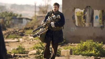Sharlto Copley plays Wikus van der Merwe, a bumbling corporate man who oversees the eviction of aliens from their shantytown.
