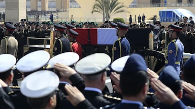 Egyptian honour guards carry the coffin of former president Hosni Mubarak. AFP