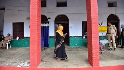 A woman leaves a polling station during municipal elections in Uttar Pradesh, India. AFP