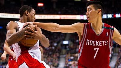 Houston Rockets' Jeremy Lin fouls Toronto's DeMar DeRozan.