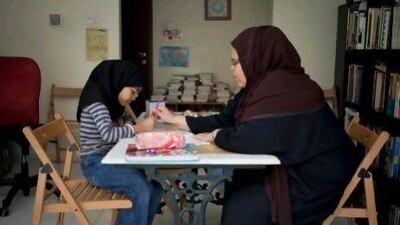 Maryam Ismail home-schools her child, Aisha Ismail, 9. Originally from New Jersey, Maryam has been living in Sharjah for the past eight years. Razan Alzayani / The National