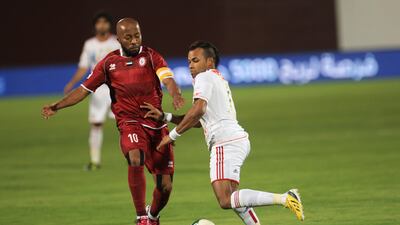 Al Jazira's Khalid Jalal dribbles the ball away from Ismail Matar. Ravindranath K / The National
