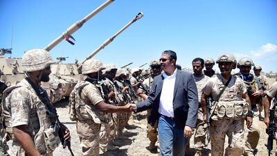 Yemeni prime minister Khaled Bahah visits a military camp near the strategic Bab El Mandeb strait which funnels shipping to and from the Suez Canal and lies at the north end of the Red Sea. WAM