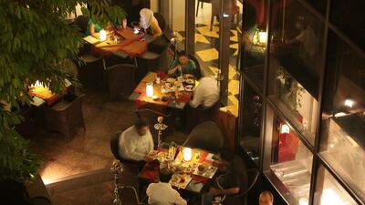 Dubai is enforcing a law that requires businesses offering shisha to not be located near schools, mosques or residences. Pawan Singh / The National