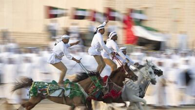 Horsemen participate in the Union March during the Sheikh Zayed Heritage Festival. Mohamed Al Suwaidi / Crown Prince Court - Abu Dhabi