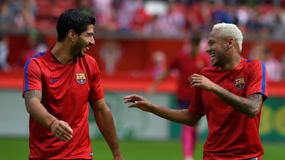In the absence of Lionel Messi, Luis Suarez, left, and Neymar, right, have kept Barcelona firing. Eloy Alonso / Reuters