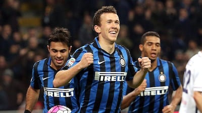 epa05208407 Inter's Ivan Perisic jubilates after scoring the goal during the Italian Serie A soccer match Inter FC vs Bologna FC at Giuseppe Meazza stadium in Milen, Italy, 12 March 2016. EPA/MATTEO BAZZI