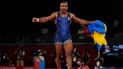 Ukraine's Zhan Beleniuk celebrates after winning gold in the men's 87kg Greco-Roman wrestling.