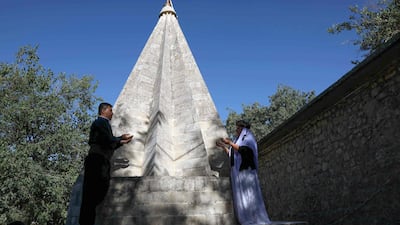 Iraqi Yazidis pray at the Temple of Lalish, in a valley near the Kurdish city of Dohuk about 430km northwest of the capital Baghdad, on July 16, 2019. AFP