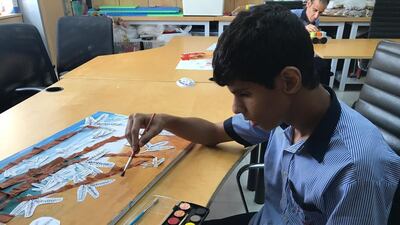 Children used Ghaf tree brushes to paint with.