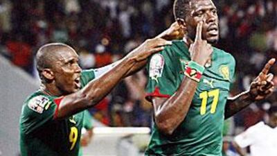 Samuel Eto'o, left, congratulates substitute Mohamadou Idrissou after he took Cameroon home in the closing moments of the game.