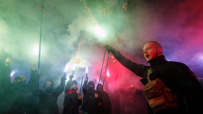 Ukrainian activists burn flares during their rally in front of Parliament building in Kiev, Ukraine, as they demand to break the diplomatic relations with Russia and nationalization of Russian property in Ukraine. EPA