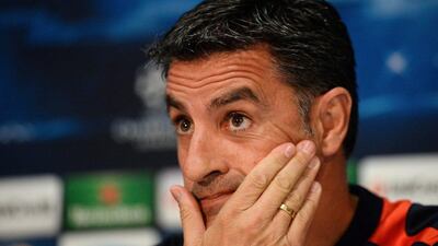 Olympiakos coach Michel attends a press conference ahead of his club's Champions League meeting with Manchester United on Wednesday. Peter Powell / EPA