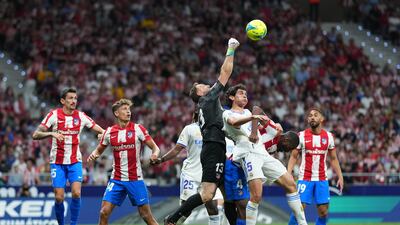 Jan Oblak of Atletico Madrid battles with Jesus Vallejo of Real Madrid. Getty Images
