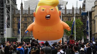 Anti-Trump protesters with a Trump baby blimp flying over Parliament Square gather for a protest against US President Donald Trump's State visit to the UK. EPA