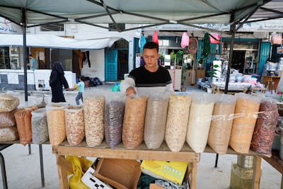 A Palestinian man sells nuts at a street market in Deir Al Balah, central Gaza. Reuters