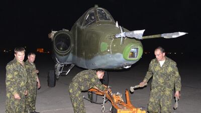 Russian soldiers unload a Russian Sukhoi SU-25 plane in Al Muthanna Iraqi military base at Baghdad airport in Baghdad, June 28, 2014. The first batch of Russian fighter jets arrived in Baghdad on Saturday to help Iraqi forces battle Islamic State of Iraq and the Levant (ISIL) fighters in the country's north. Reuters