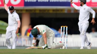 South Africa batsman Dean Elgar, center, after being hit by delivery from India bowler Umesh Yadav. AP