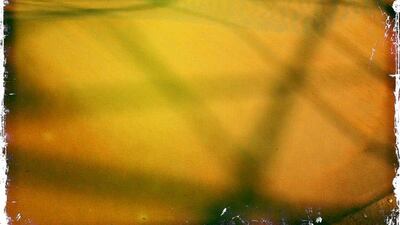 Day trip with friends to the Western Region and the Mazayin Dhafra Camel Festival, 220 kms west of Abu Dhabi on December 20, 2013. High tension wires cast a shadow over sand dunes. Picture taken with the Hipstamatic app for the iPhone. Liz Claus / The National